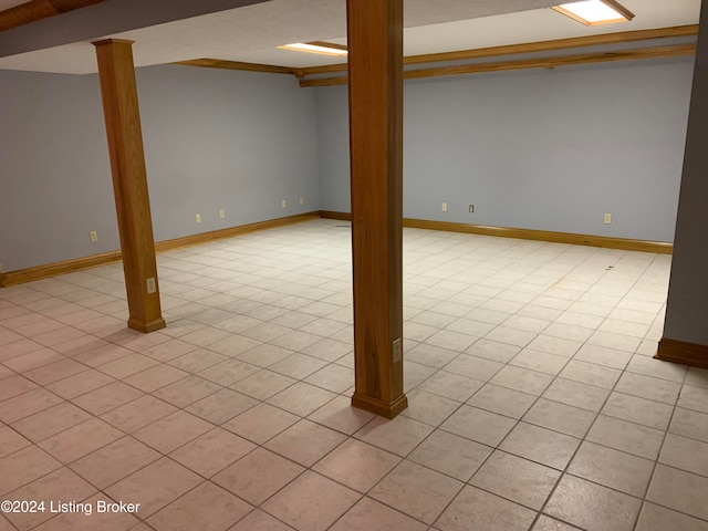 basement featuring light tile patterned floors