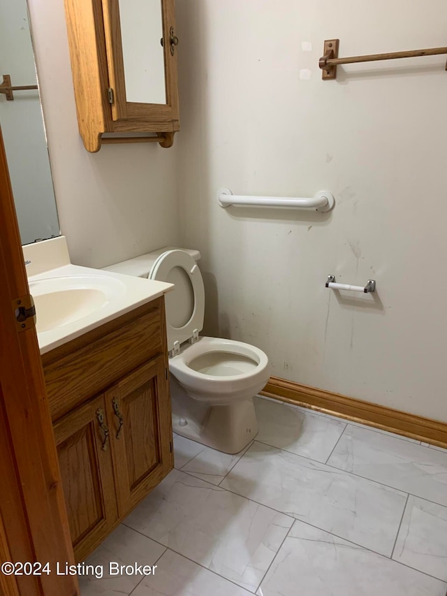 bathroom with vanity and toilet