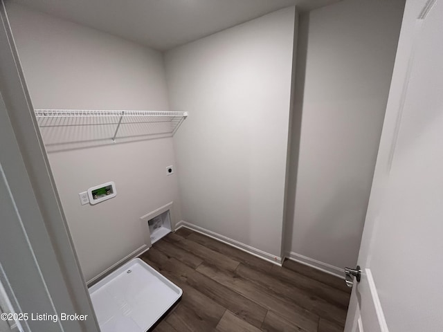 washroom featuring hookup for an electric dryer, laundry area, dark wood-type flooring, washer hookup, and baseboards