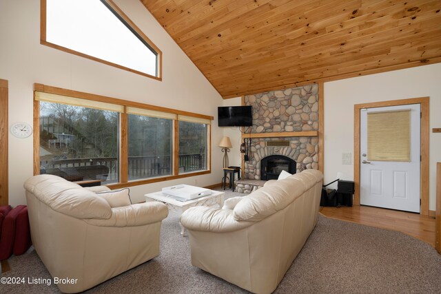 living room featuring wood ceiling, a fireplace, high vaulted ceiling, and wood-type flooring