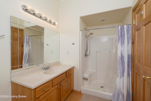 bathroom featuring vanity and walk in shower