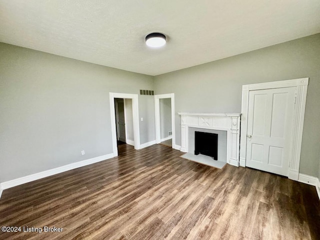 unfurnished living room featuring wood-type flooring