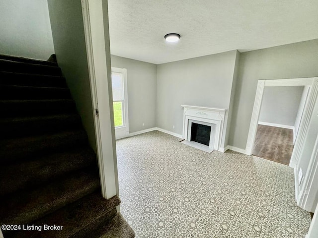 living room with a textured ceiling