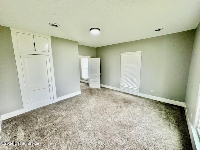 unfurnished bedroom with carpet floors