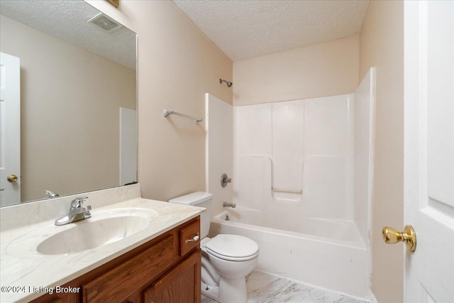 full bathroom with vanity, a textured ceiling, toilet, and  shower combination