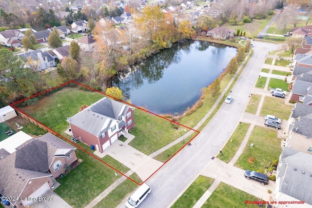 birds eye view of property featuring a water view