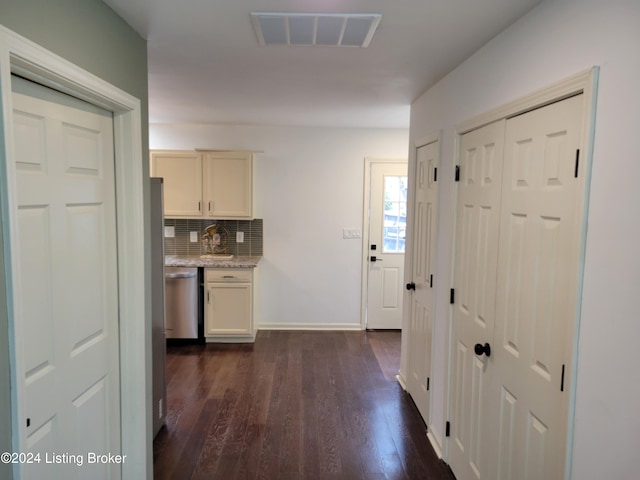 corridor featuring dark hardwood / wood-style floors