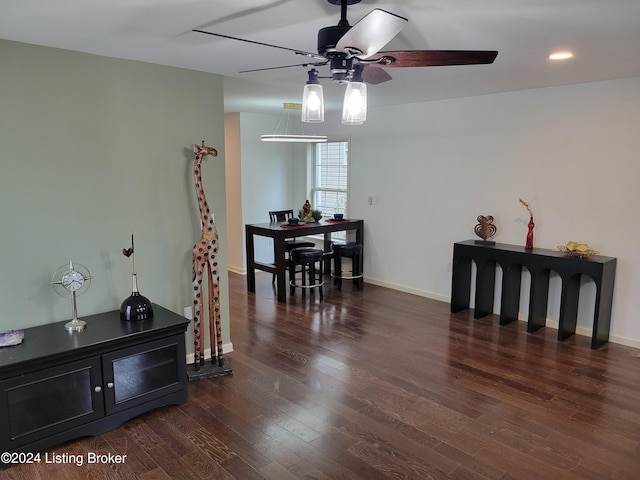 dining area with dark hardwood / wood-style flooring and ceiling fan