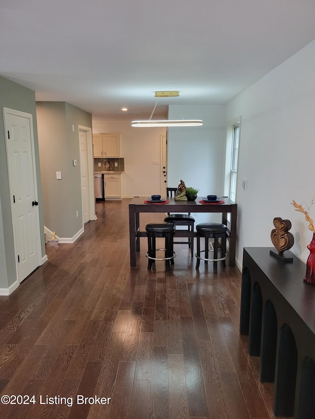 dining room with dark wood-type flooring