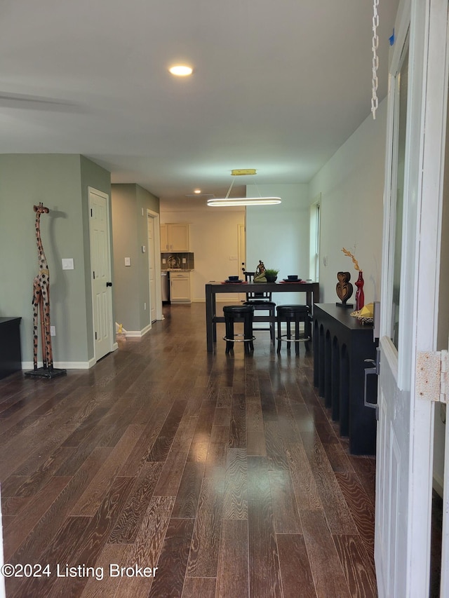 dining space featuring dark hardwood / wood-style flooring