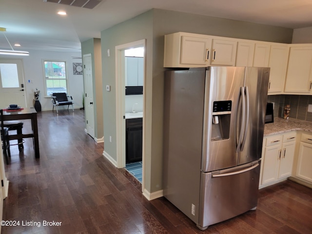 kitchen featuring decorative backsplash, white cabinetry, stainless steel refrigerator with ice dispenser, and dark wood-type flooring