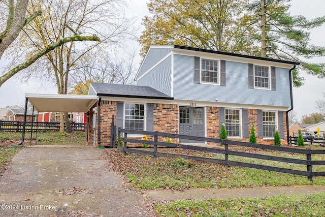 view of front of property featuring a carport