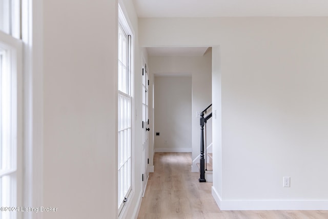 hall with light wood-type flooring