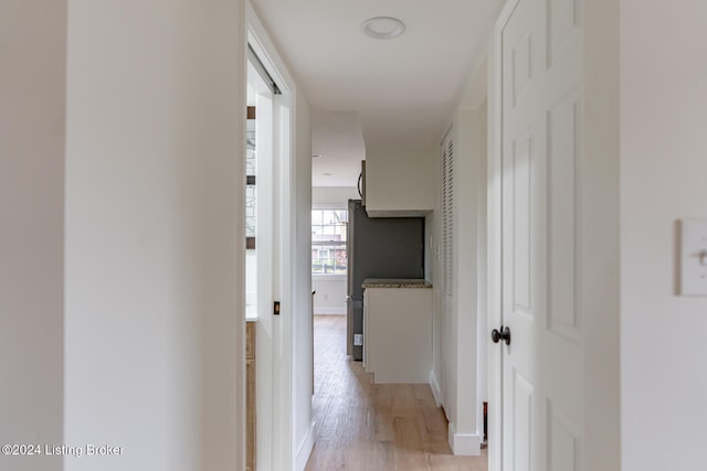 corridor featuring light hardwood / wood-style floors