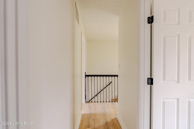 hall with light wood-type flooring