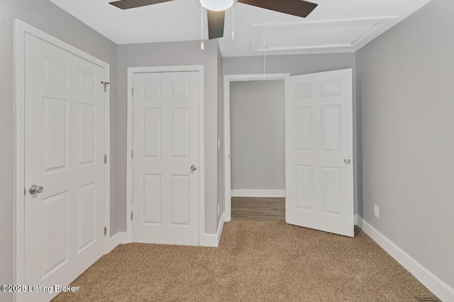 unfurnished bedroom with ceiling fan and carpet flooring