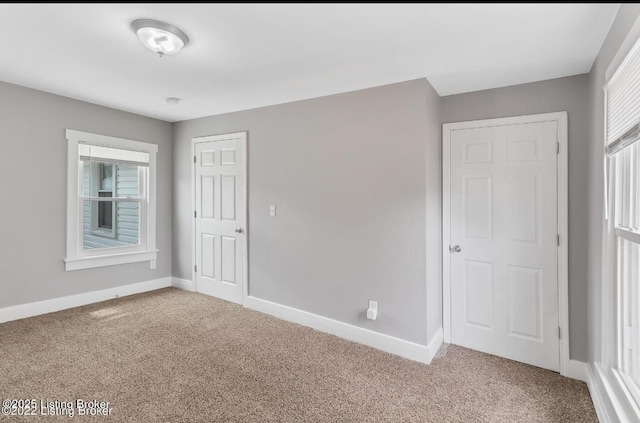 unfurnished room with carpet