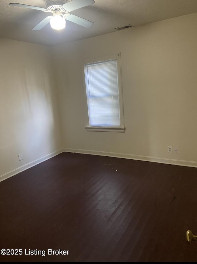 unfurnished room featuring ceiling fan and hardwood / wood-style floors