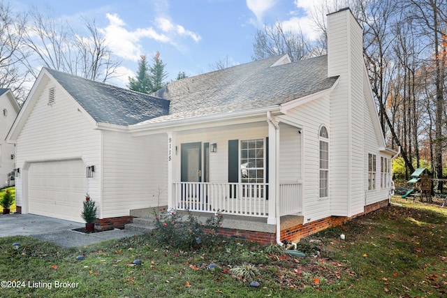 view of front facade featuring covered porch, a playground, a garage, and a front yard