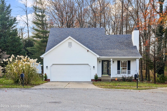 view of front facade featuring covered porch and a garage