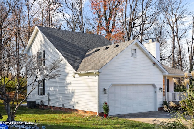 view of home's exterior with central air condition unit, a yard, and a garage