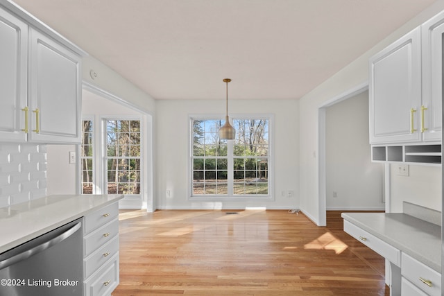 unfurnished dining area featuring light hardwood / wood-style flooring