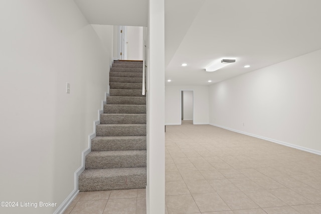 stairway featuring tile patterned floors