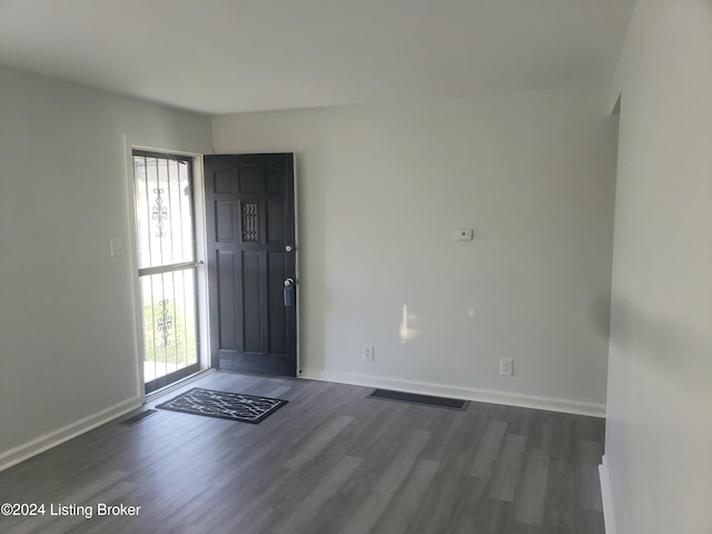 foyer entrance featuring dark hardwood / wood-style floors