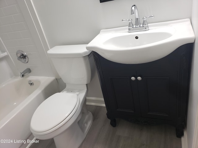 full bathroom with vanity, toilet, wood-type flooring, and shower / washtub combination