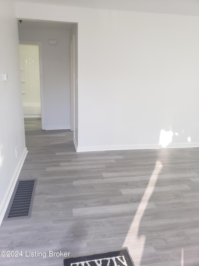 empty room with hardwood / wood-style floors