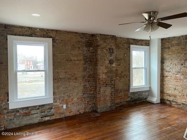 misc room featuring ceiling fan and dark hardwood / wood-style floors