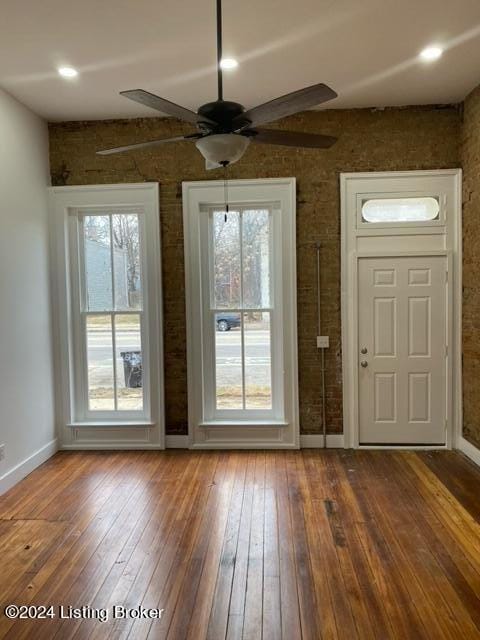 entryway featuring wood-type flooring and ceiling fan