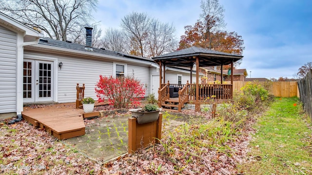 back of house with a gazebo and a deck