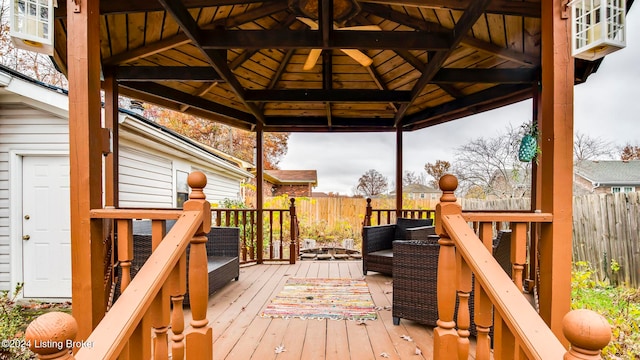 wooden terrace featuring a gazebo