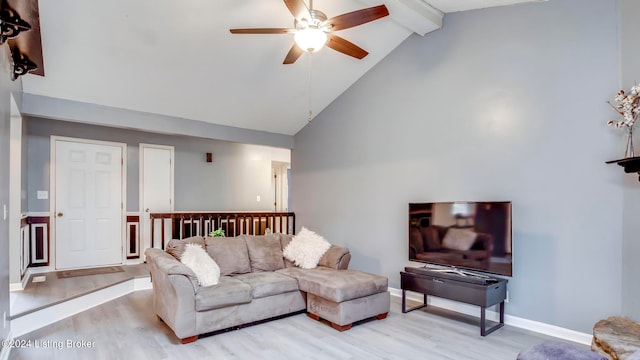 living room featuring ceiling fan, beamed ceiling, high vaulted ceiling, and light wood-type flooring