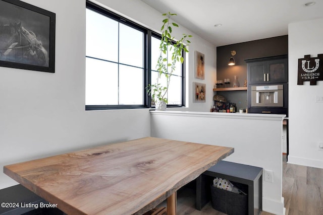 dining room featuring a wealth of natural light, breakfast area, and hardwood / wood-style flooring