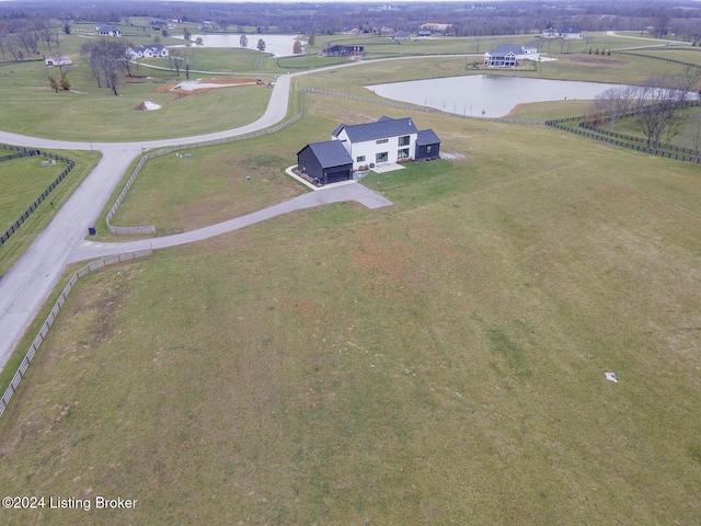 birds eye view of property featuring a rural view and a water view