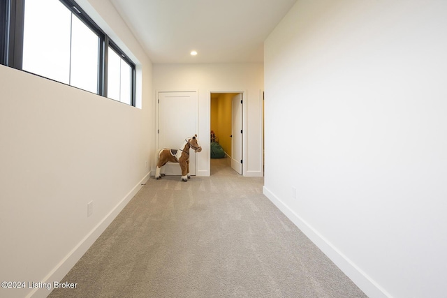 corridor with light carpet