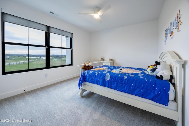 carpeted bedroom with ceiling fan