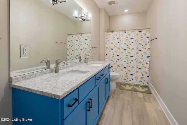 bathroom featuring walk in shower, a chandelier, wood-type flooring, toilet, and vanity