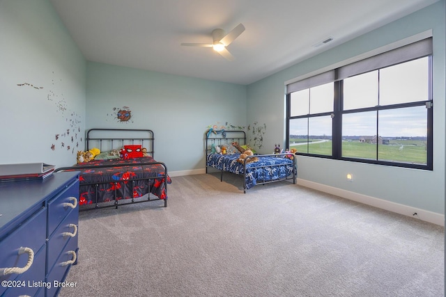 carpeted bedroom with ceiling fan