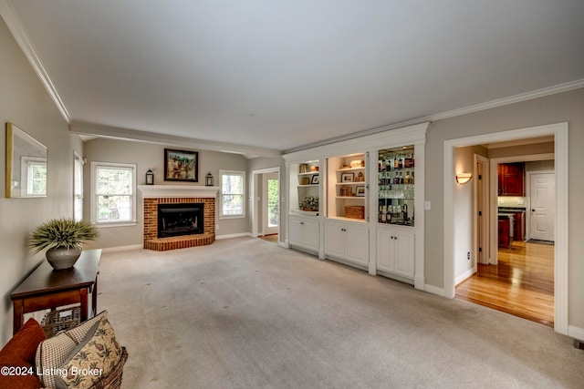 living room with ornamental molding, a fireplace, and light carpet