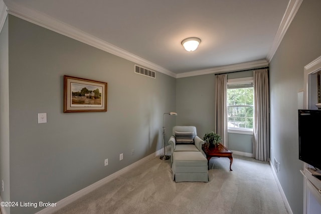 living area with light carpet and ornamental molding