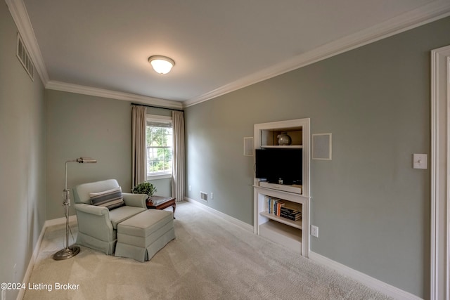 living area featuring light carpet and ornamental molding