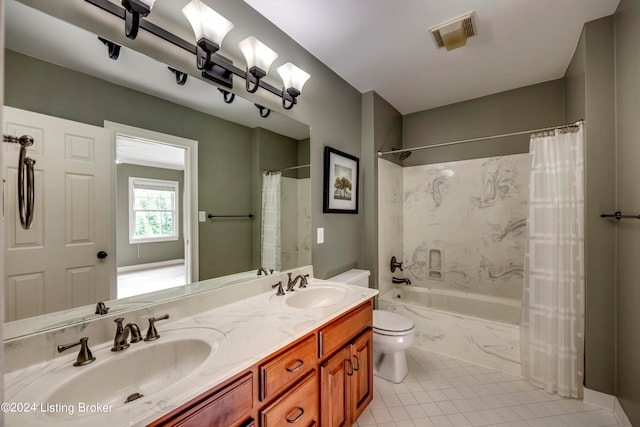 full bathroom featuring toilet, shower / bath combo with shower curtain, vanity, and tile patterned flooring