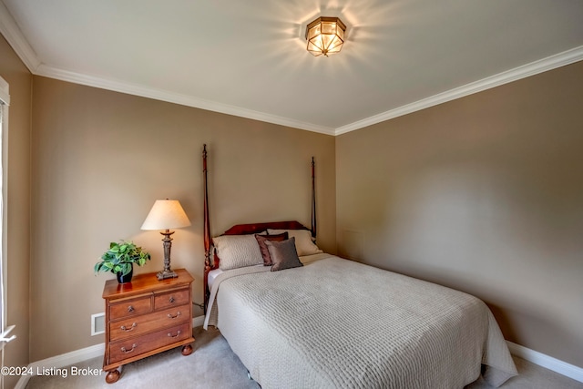 bedroom with light carpet and ornamental molding