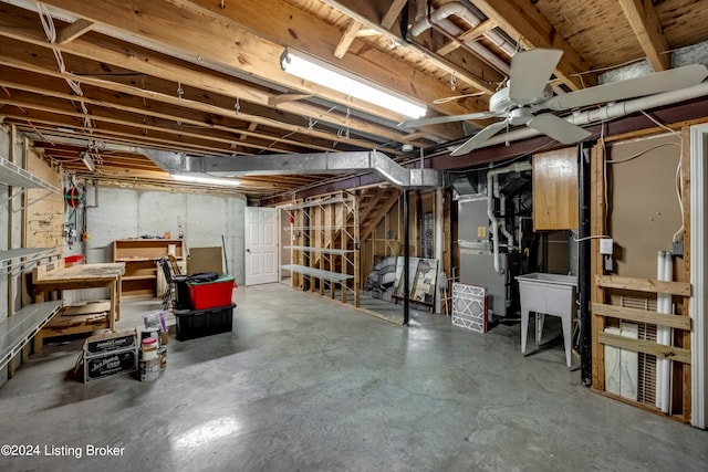 basement with sink and heating unit