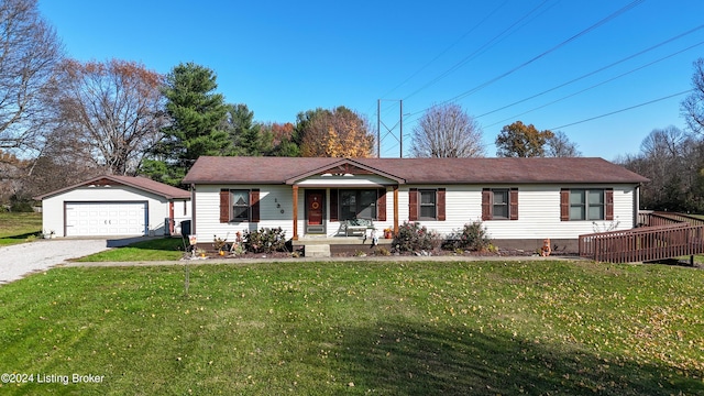 single story home featuring an outbuilding, a front yard, and a garage