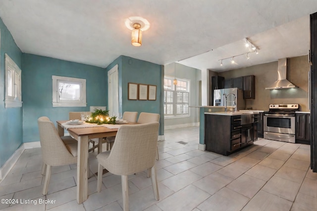 tiled dining area featuring sink