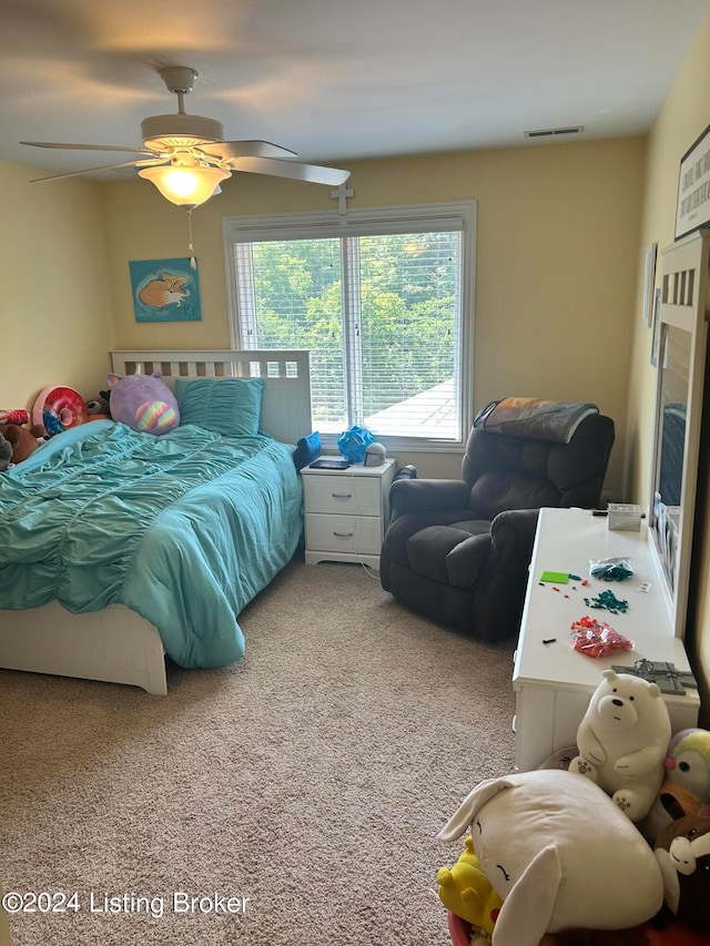 carpeted bedroom featuring ceiling fan